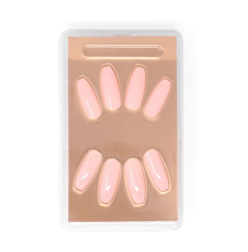 Ballerina shaped, medium length Nude Desire nails with a rose tint, suitable for all skin tones. Comes with 24 nails in 12 sizes, adhesive, mini nail file, and a manicure stick for easy application and extreme gloss finish.