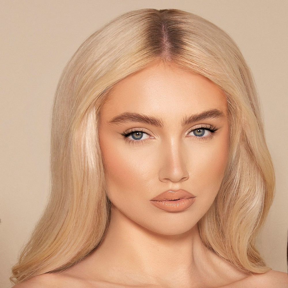 Glow Coral from the Bestselling Cream Stick Collection, a super creamy and highly pigmented beauty stick that provides a radiant glow and flawless finish.