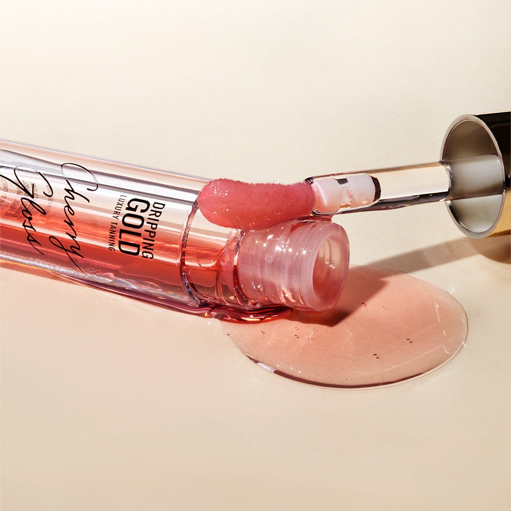 A bottle of Cherry Gloss Hydrating Lip Oil from SOSU Cosmetics, designed to provide ultra-soft, glowy lips with a non-sticky, non-greasy texture