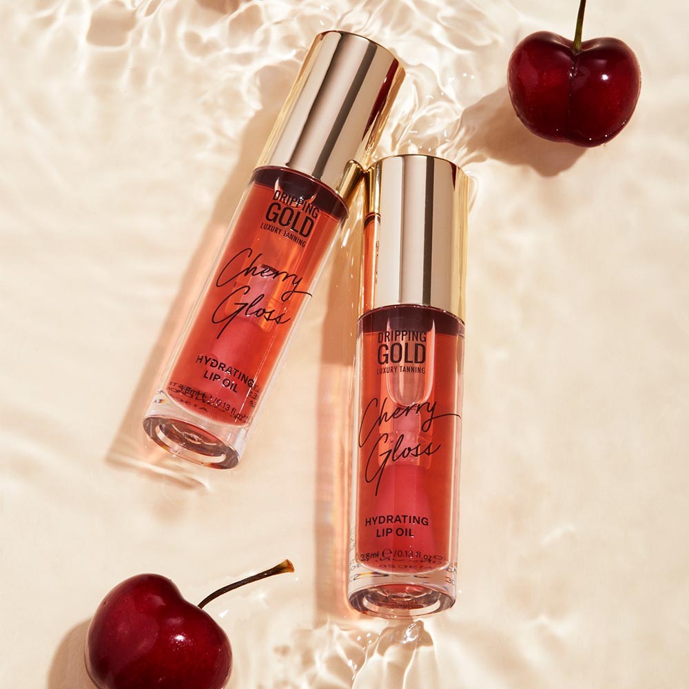 A Cherry Gloss Hydrating Lip Oil by SOSU Cosmetics, infused with Macadamia Nut Seed Oil and Jojoba Seed Oil for ultra-soft, glowy lips