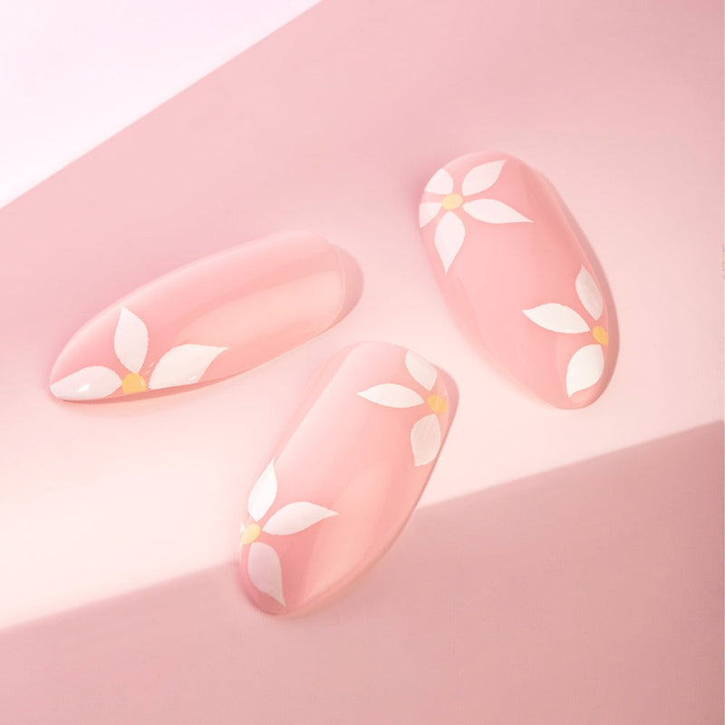 Medium-length stiletto-shaped Daisy Faux Nails with daisy details, perfect for a summer look