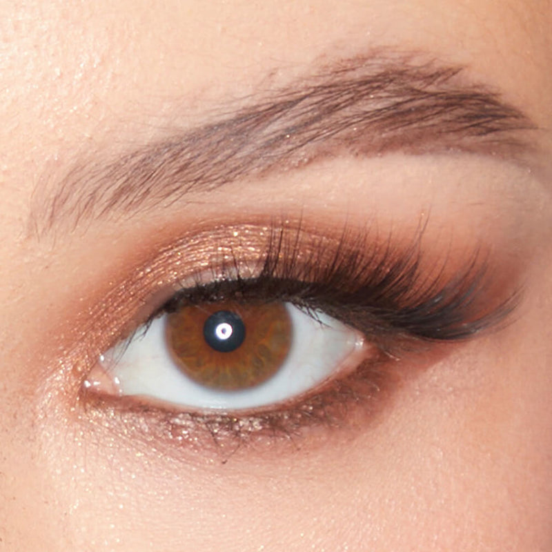 Close-up of an eye adorned with a shimmering bronze eyeshadow from the SOSU x Bonnie Ryan Palette, showcasing its rich pigmentation and sparkle.