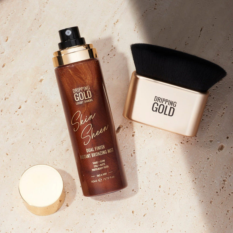 Dripping Gold's Skin Sheen Instant Bronzing Mist in a bottle, offering a dual finish for instantly bronzed, photo-ready skin that feels soft and hydrated