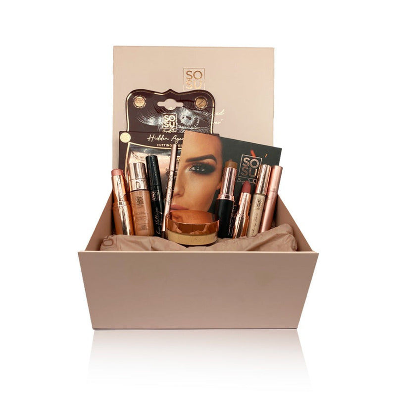 Suzanne's Summer Faves Bundle curated by Suzanne, including Radiance base, Concealer, Setting powder, Contour Stick, Blush Stick, Hot Fire, Hidden Agenda, Mascara, Kohl Pencil, Lipstick, and Freckle pen, all packaged in a gorgeous pink SOSU Cosmetics magnetic gift box