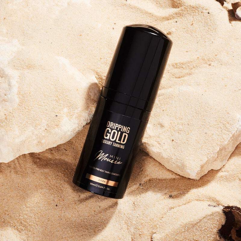 Travel-sized Dripping Gold Luxury Mini Mousse in a dark shade for a bronzed and glowing skin, vegan-friendly and cruelty-free