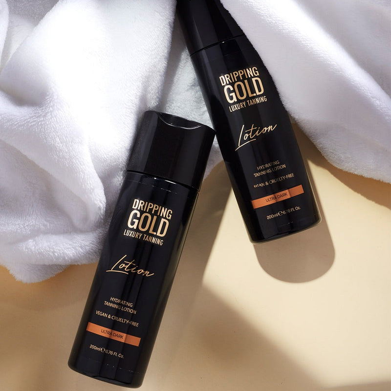Dripping Gold Luxury Lotion in Ultra Dark shade, a hydrating tanning lotion that offers an intense deep tone, enriched with skin-loving ingredients and is vegan and cruelty-free