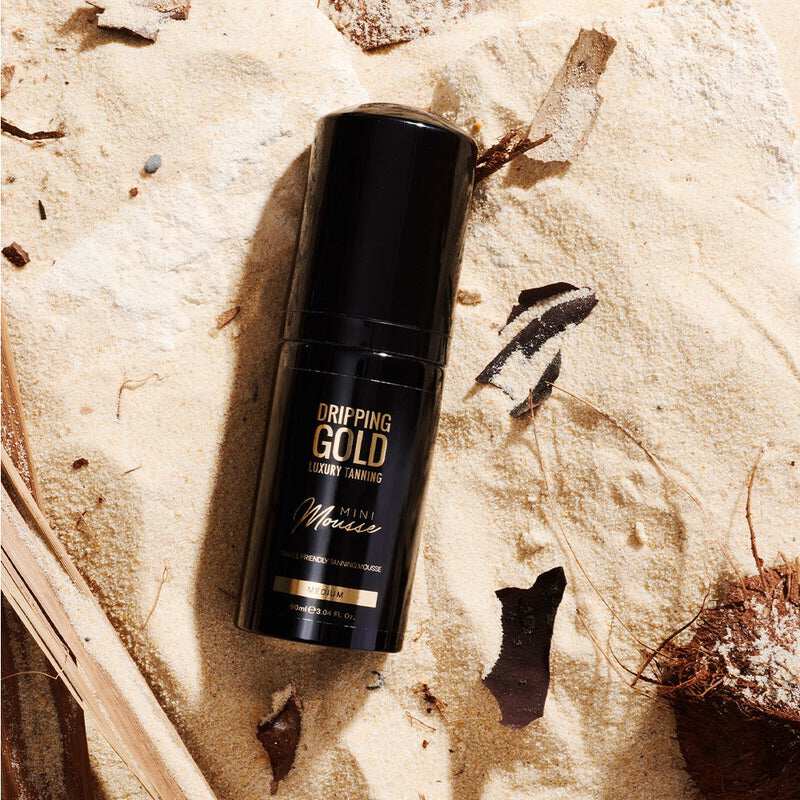 Dripping Gold Luxury Tanning Mini Mousse in Medium shade, perfect for tanning on the go and providing a golden olive tone, ultra hydrating and streak-free application
