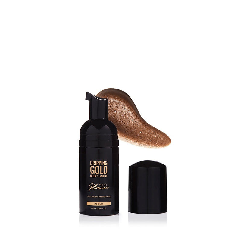 Dripping Gold Luxury Tanning Mini Mousse in Medium shade, perfect for tanning on the go, offering a golden olive tone and ultra hydrating, streak-free application