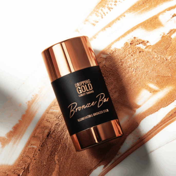 Dripping Gold Bronze Bar Illuminating Bronzer Stick, perfect for an easy-to-use face and body bronzing with a glossy finish and delicious coconut scent