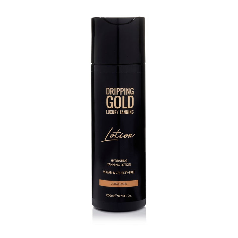 Dripping Gold Luxury Lotion in Ultra Dark shade, a hydrating tanning lotion that is vegan and cruelty-free, providing a silky smooth, bronzed application for a stunning glow