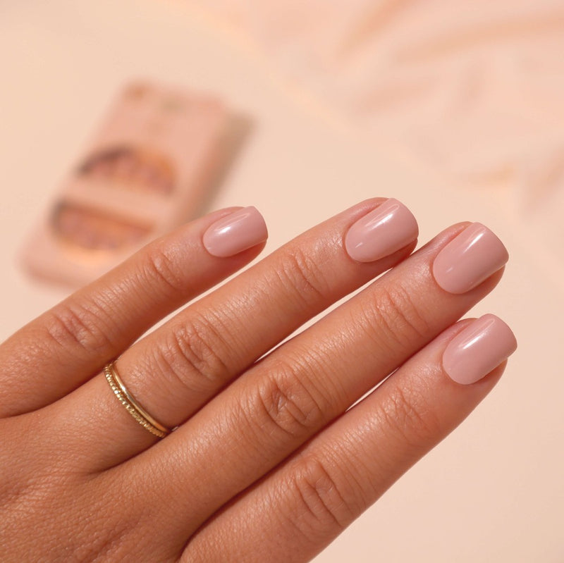 Hand showcasing Toffee Bliss short square nails with creamy toffee undertones, providing a perfect nude shade for day to night wear