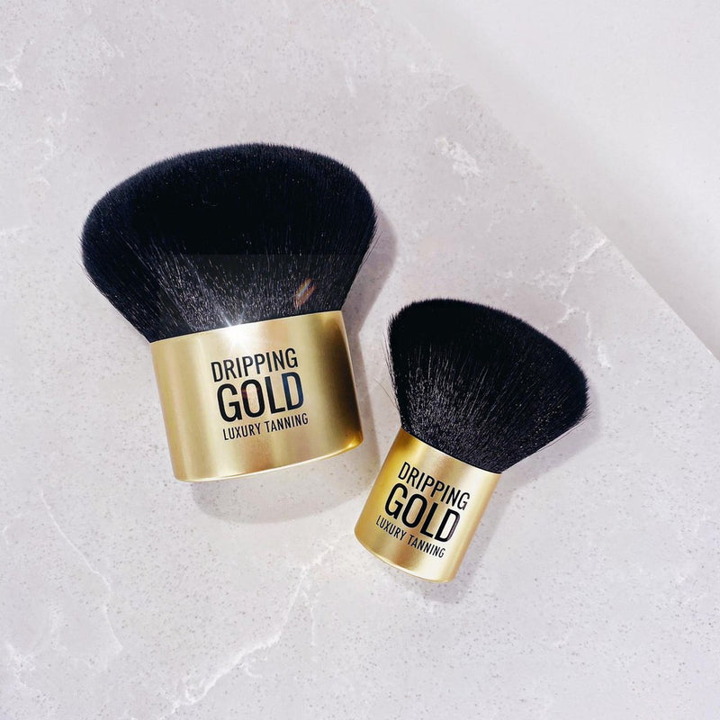 The Dripping Gold Mini Kabuki Brush, a perfect tool for applying and blending face tan and bronzing powder, featuring luxury synthetic anti-bacterial fibres for a flawless finish