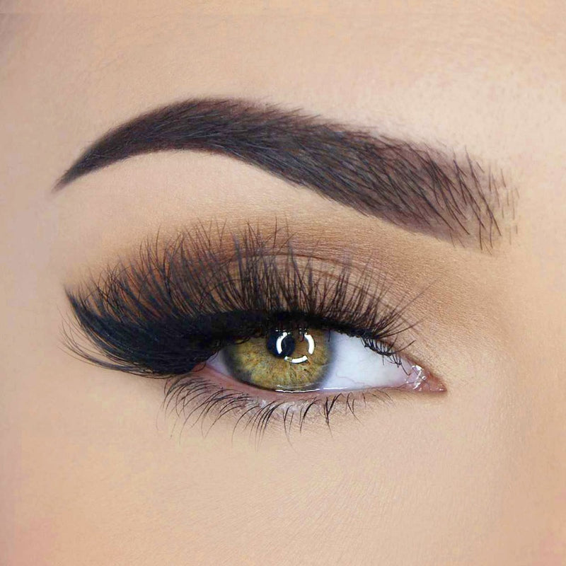 A person wearing the Desire - 7 Deadly Sins lashes, displaying their striking length and high voltage volume. These lashes are part of the SOSU Cosmetics 7 Deadly Sins Lash Collection.