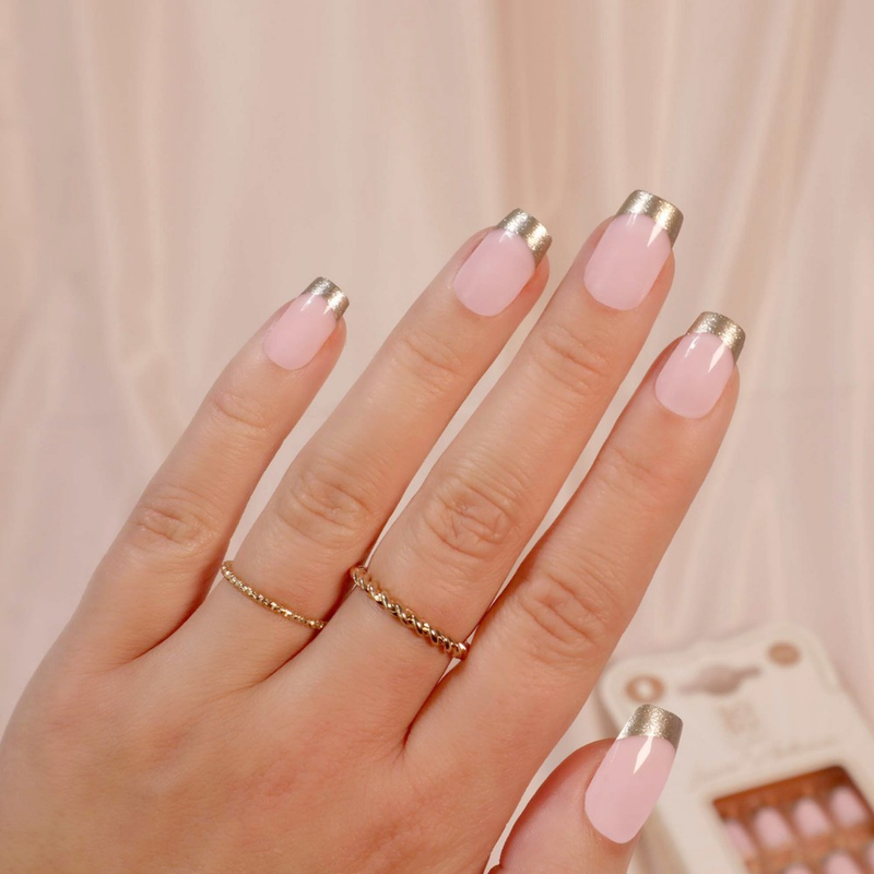 SOSU Cosmetics X Laura Anderson's Goal Digger false nails with beautiful gold tips, in a classic square shape and medium length for the perfect nude manicure