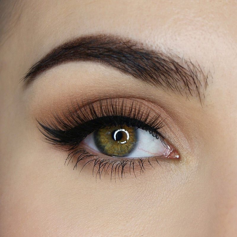 A model showcasing the maximum volume of the Excess Eye Voltage Lash from SOSU Cosmetics, with features like jet black curved lash band, and soft 3D synthetic fibers