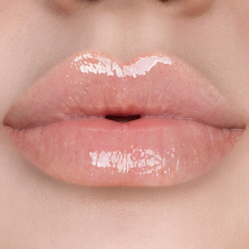 The 'If You Say So' Shimmer Lip Gloss from SOSU Cosmetics, a perfect clear gloss with a hint of shimmer for a high shine sheer finish and long-lasting glow